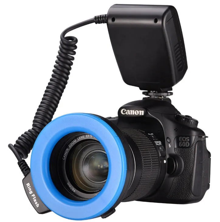Traveller RF-550D macro ring flash with 48 LEDs, LCD display, and eight adapter rings 49-77mm on black background