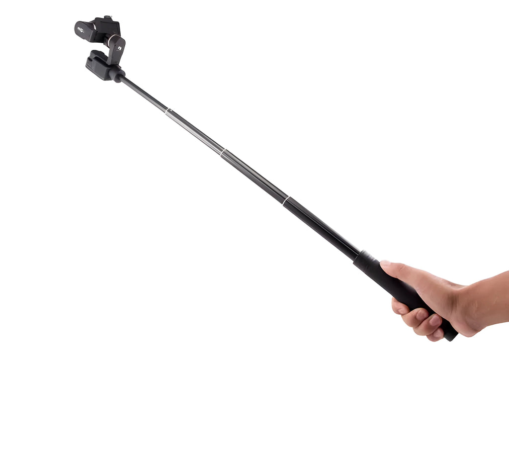 Black retractable aluminium selfie stick extended, with a smartphone mounted on the holder.