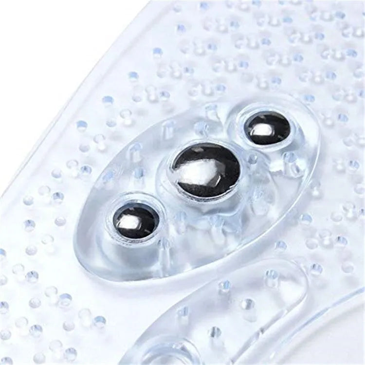 Transparent magnetic massage insole with silicone elastomer, visible magnets and massage nubs, on white background