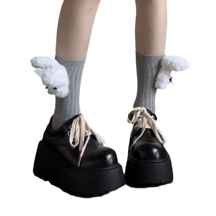 Matte black women's lace-up platform shoes with thick rubber sole and retro block heel.