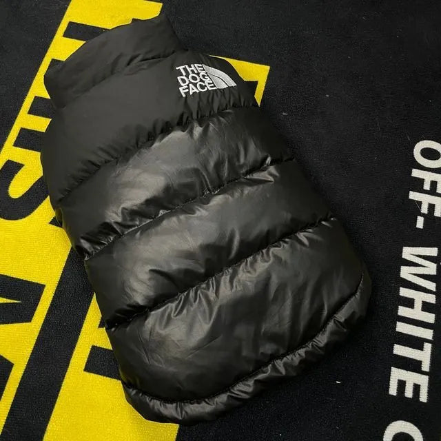 Thick warm down vest for dogs in black, showing side view, sizes S to XXL