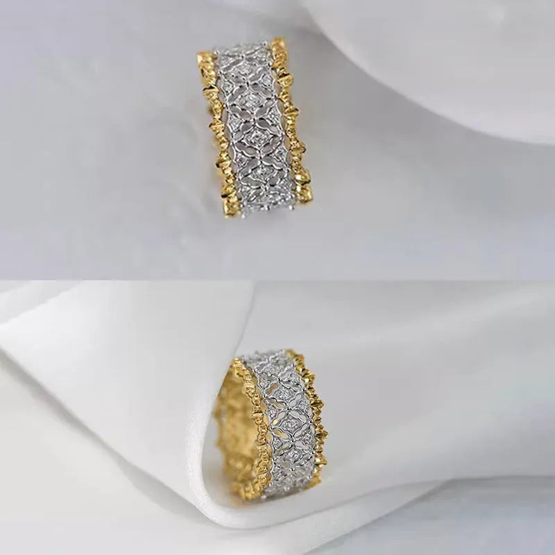 Geometric two-tone gold zircon ring with a round stone on a copper band.