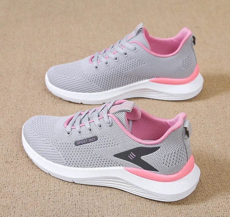 Low-top women's casual running shoes in beige with mesh upper, round toe, and front lace-up closure