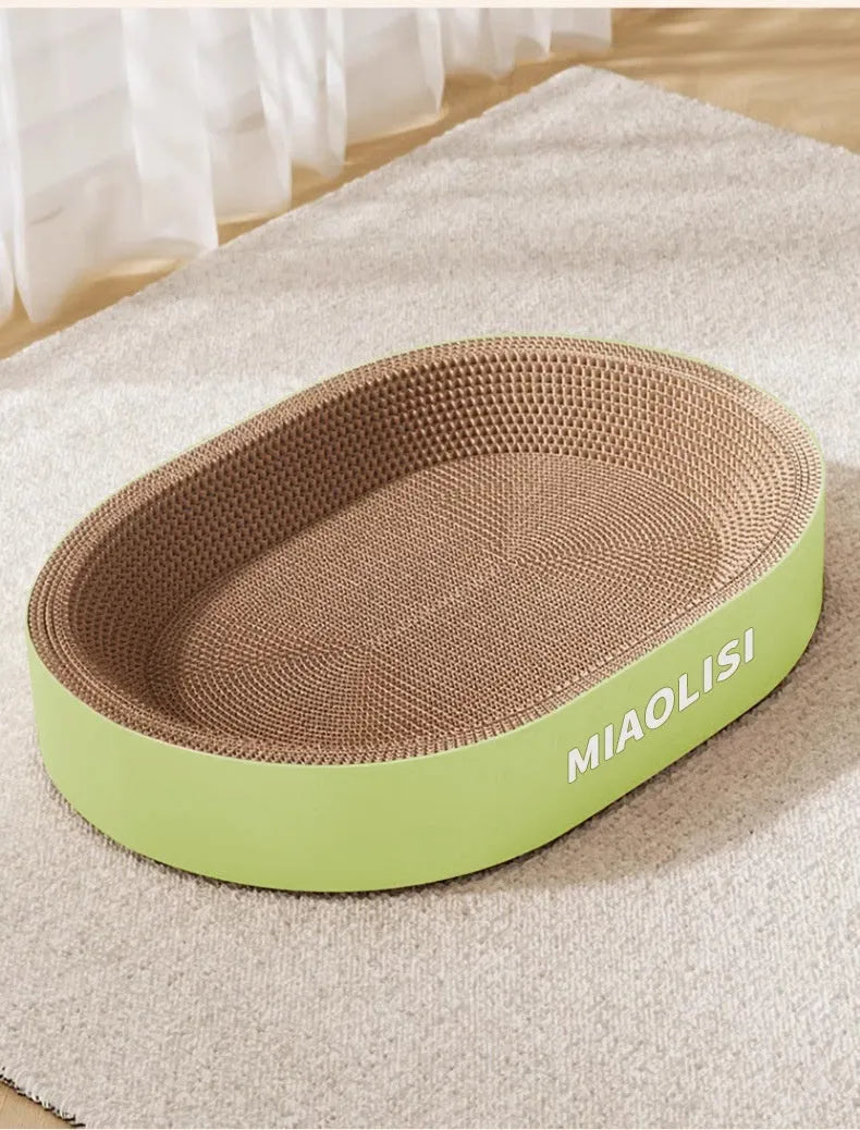 Green oval corrugated paper cat scratch board and lounging nest with a 55cm diameter.