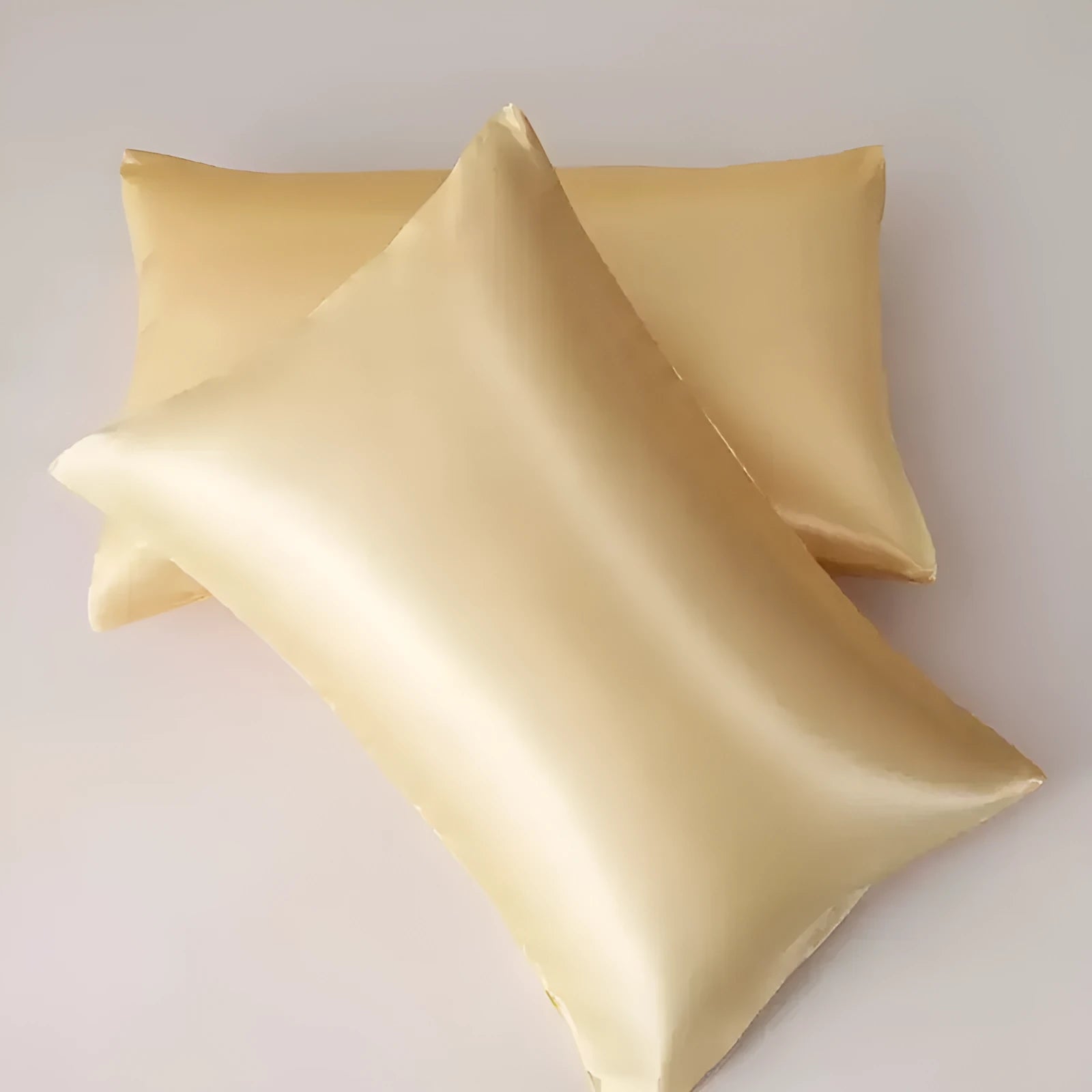 A pair of solid colour satin weave polyester pillowcases in one of thirteen available shades.