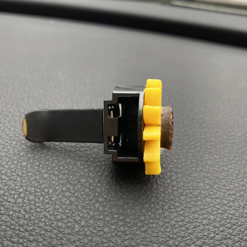 Yellow sunflower car vent perfume clip measuring 8cm with secure mounting clip for air freshening