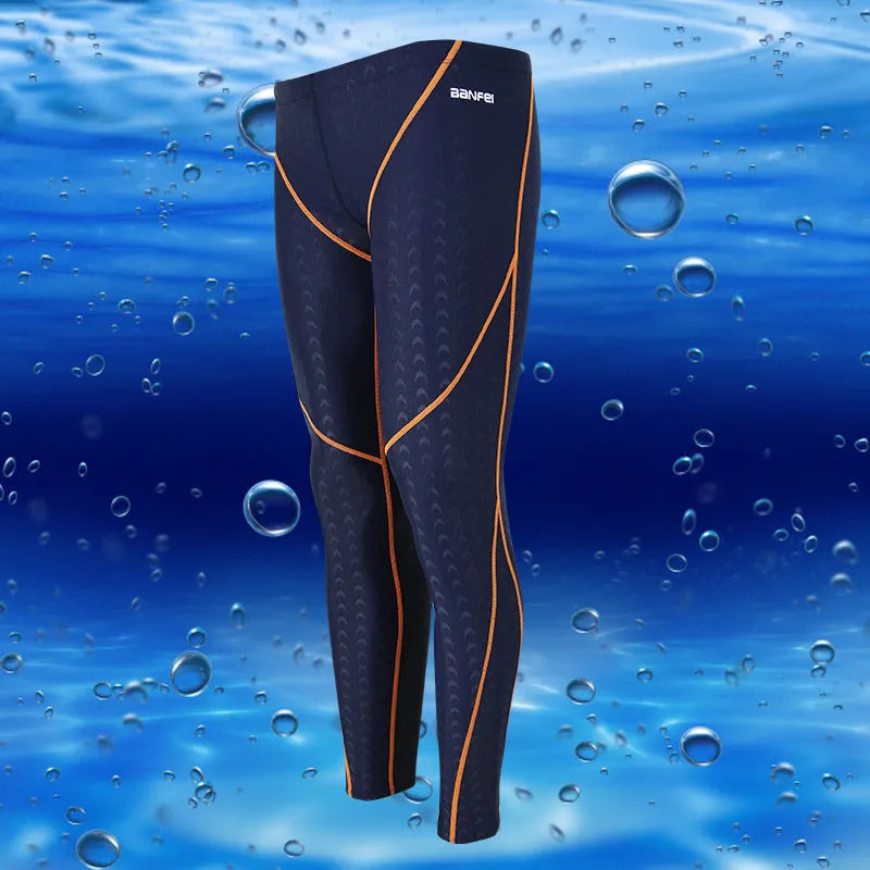 Men's black and grey cropped nylon swimming trunks with mesh lining laid flat.