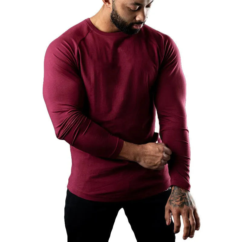 Men's long sleeve cotton sports t-shirt in tight fit with round neck, available in multiple colours