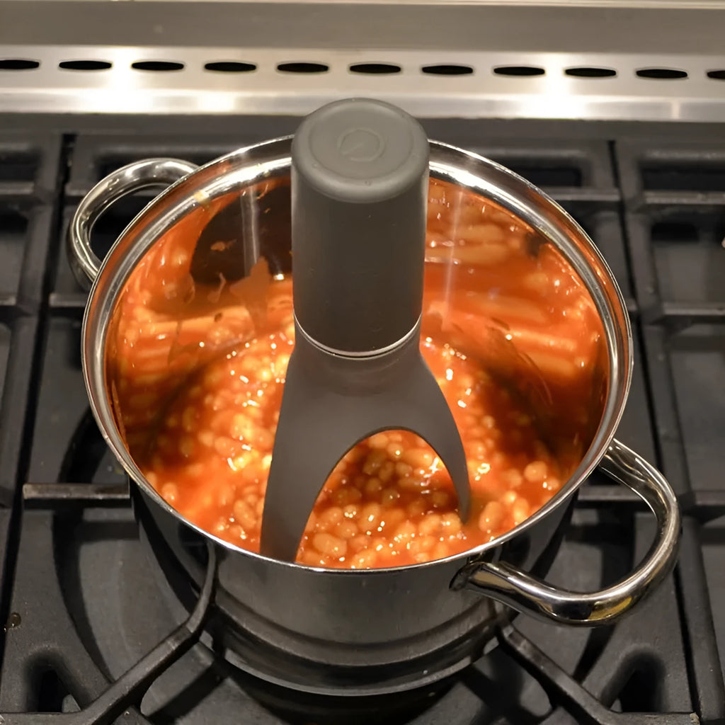 Green Uutensil Stirr automatic cooking mixer device for stirring sauces and soups.