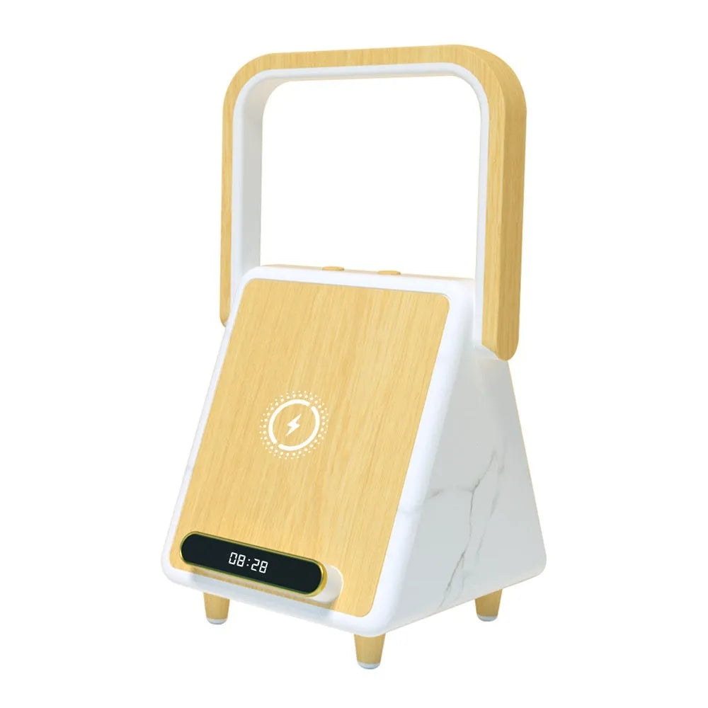 Wireless charging induction Bluetooth speaker small night lamp in Platinum Jazz finish with USB cable on a wooden desk