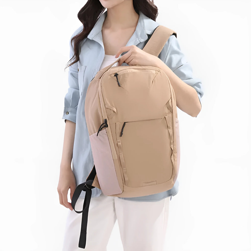 Solid-colour unisex backpack made from waterproof Taslan cloth with a curved shoulder strap.