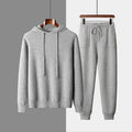 Men's light grey hooded knitted sweatshirt and matching trousers casual winter set.