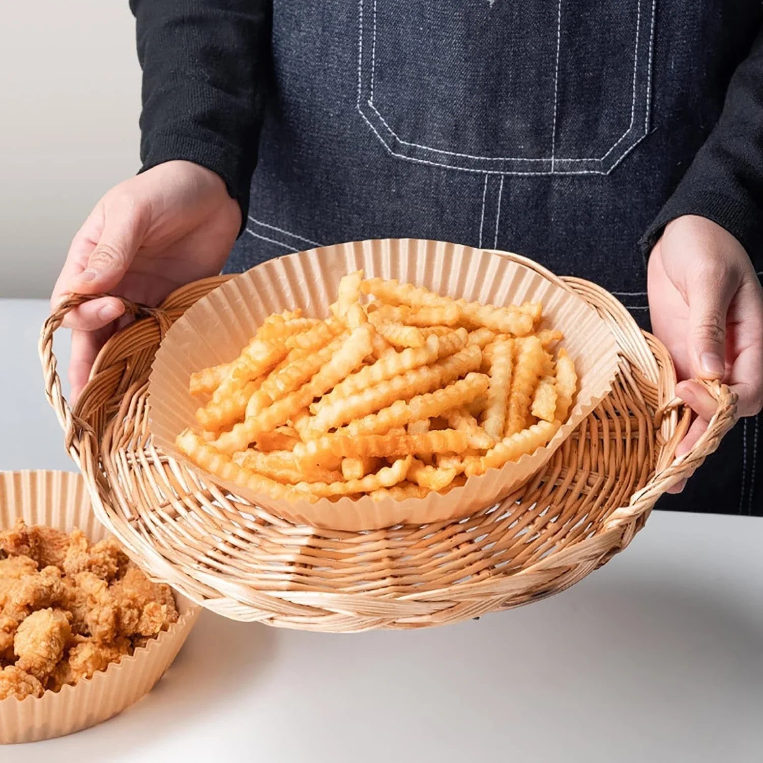 Premium disposable air fryer liners made of heat-resistant parchment paper, designed to keep your appliance clean and make cooking mess-free.