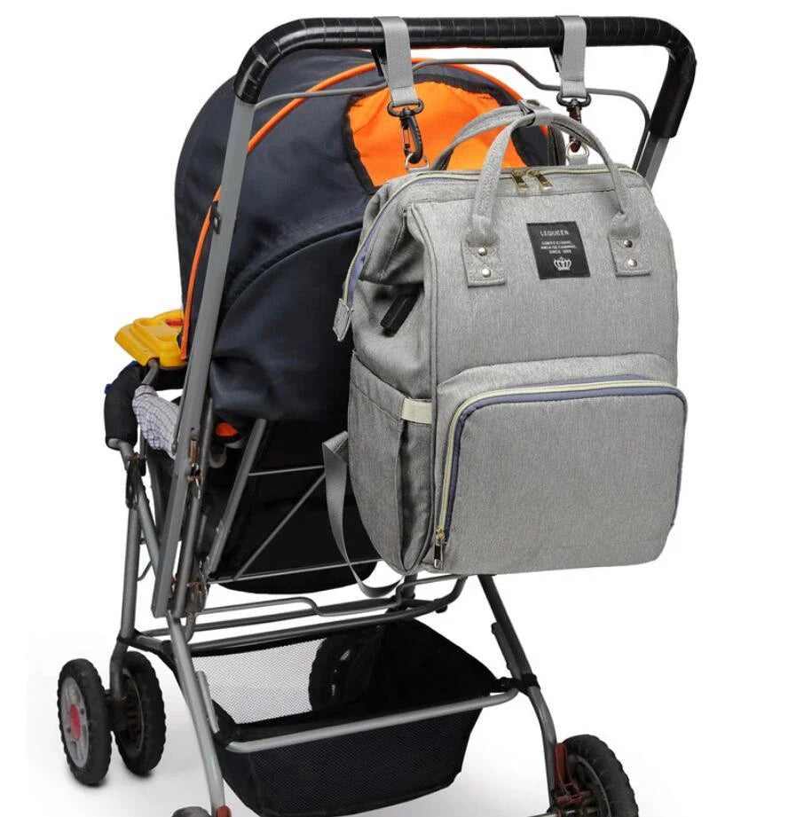 A stylish and practical mummy backpack with features like an insulated bottle compartment, USB charging port, and water-resistant construction.