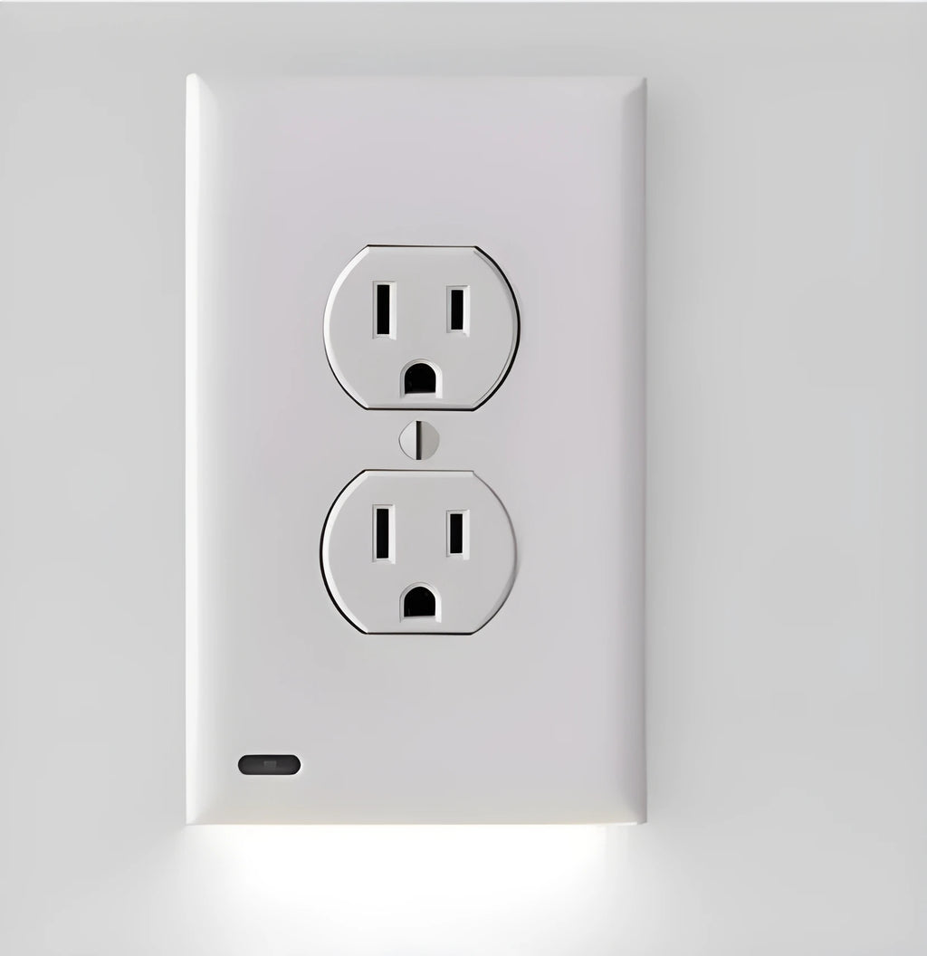 White plug-in LED socket night light installed in a wall socket, showing automatic sensor.