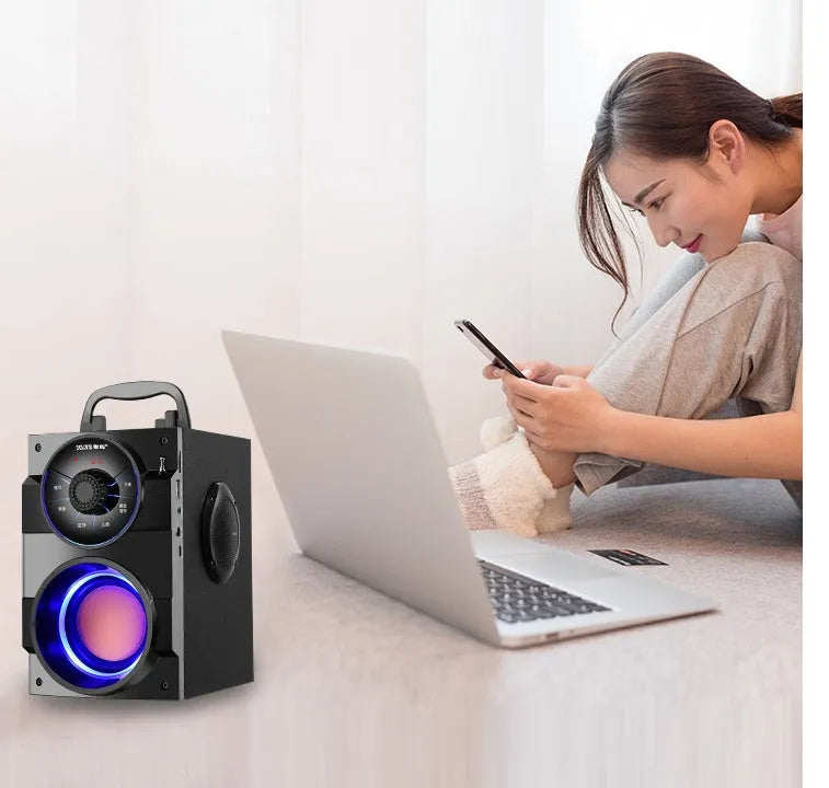 Black portable mini audio system with subwoofer and 3.5mm connection cable