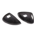 True carbon fibre exterior mirror covers for a Porsche Macan, shown in high-gloss black.