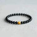 Black obsidian geometric bead bracelet in Korean style, showing 6mm, 8mm and 10mm size options.