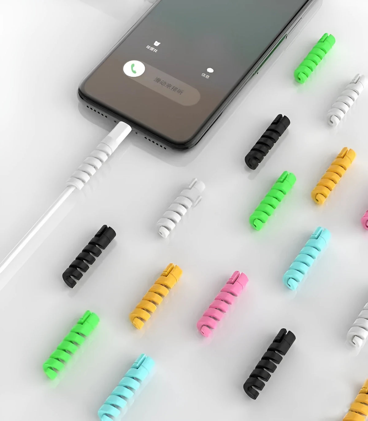 Close-up of a black rigid plastic charging cable protector next to a smartphone charging cable.