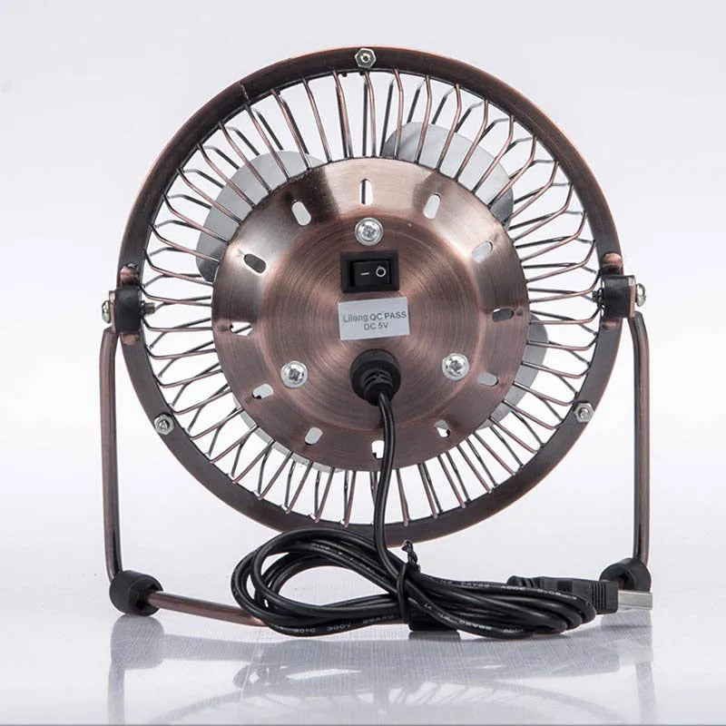 4-inch metal USB mini fan in bronze colour with rocker switch on desk