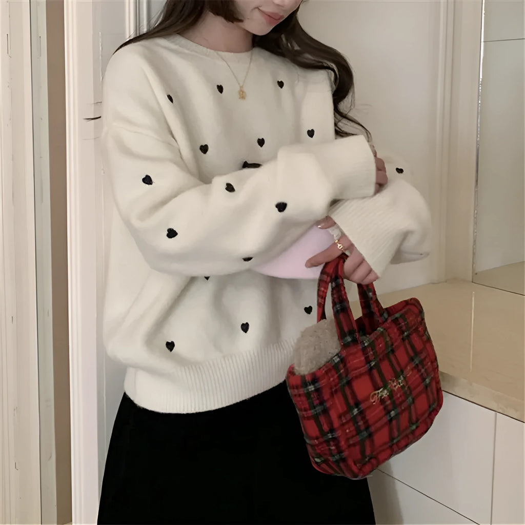 Beige loose-fit women's acrylic pullover sweater with long sleeves and chest embroidery.
