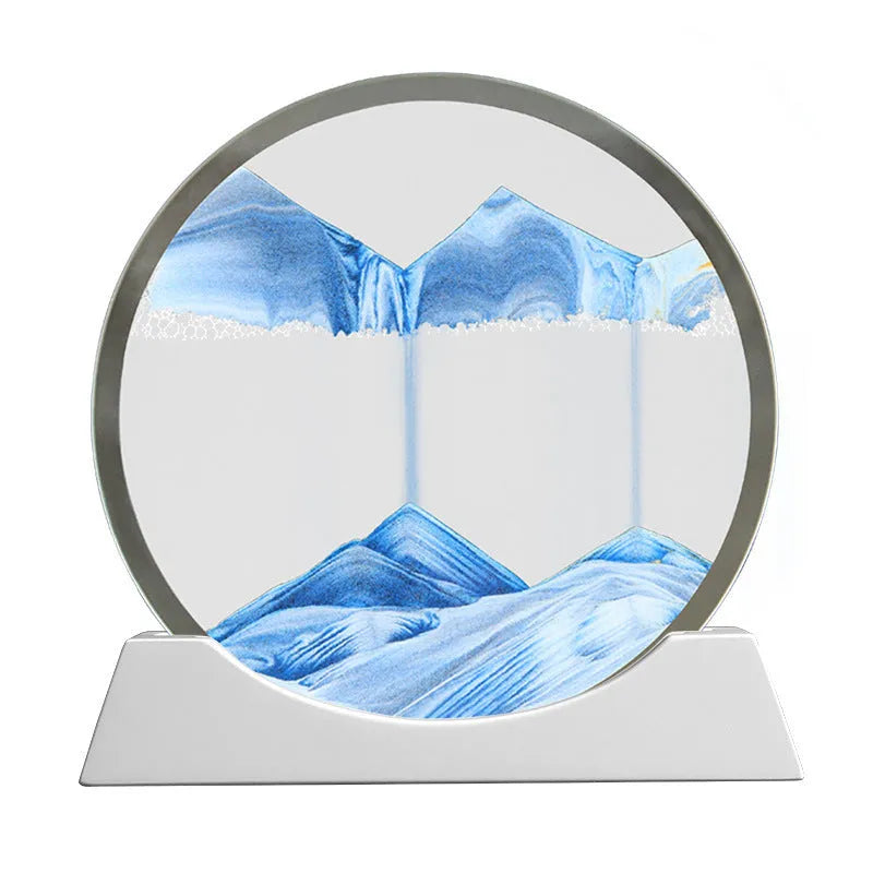 Creative quicksand painting rotary night lamp on a desk, showing abstract colours inside a 12-inch glass cylinder.