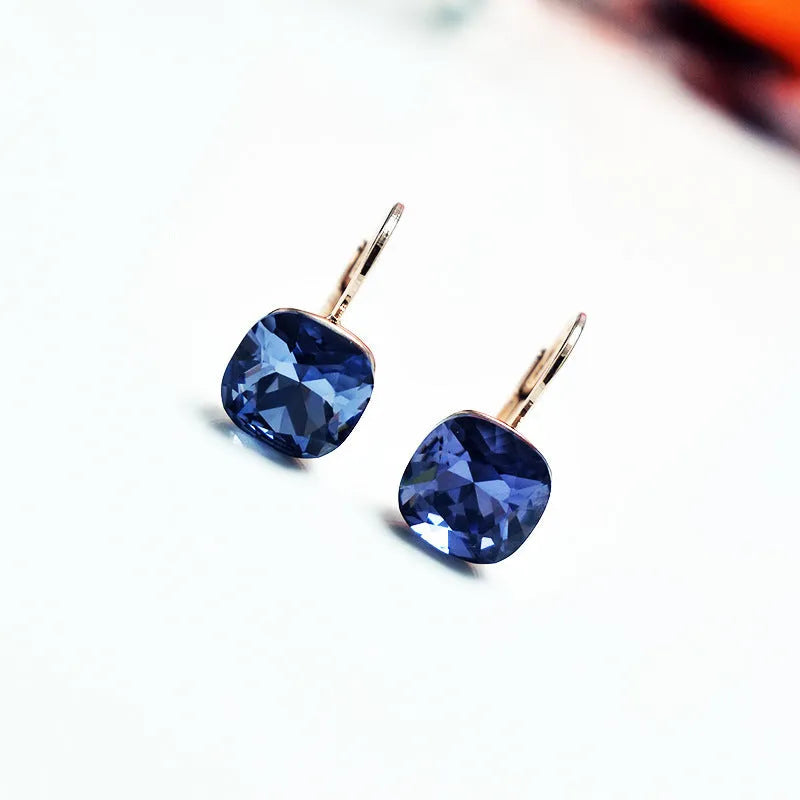 Austrian crystal geometric copper ear studs for women in champagne gold colour