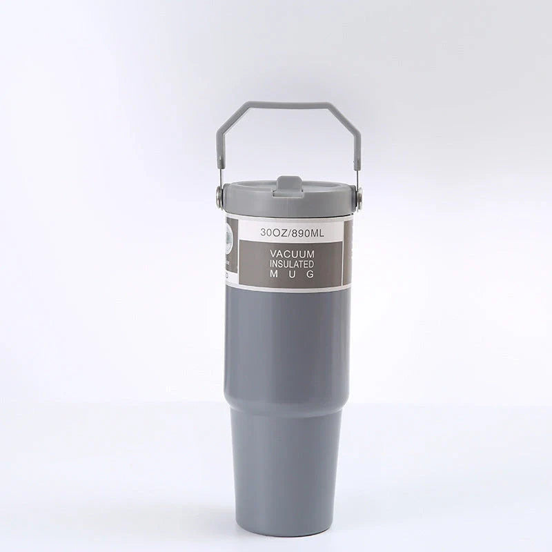 Insulated stainless steel travel tumbler with double-wall vacuum technology, sweat-proof powder coating, and BPA-free sliding lid for hot and cold drinks on the go.