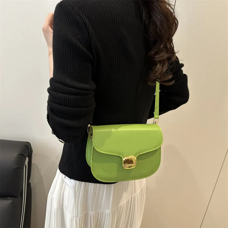 Simple PU leather women's handbag with interior zippered compartment and mobile phone pocket