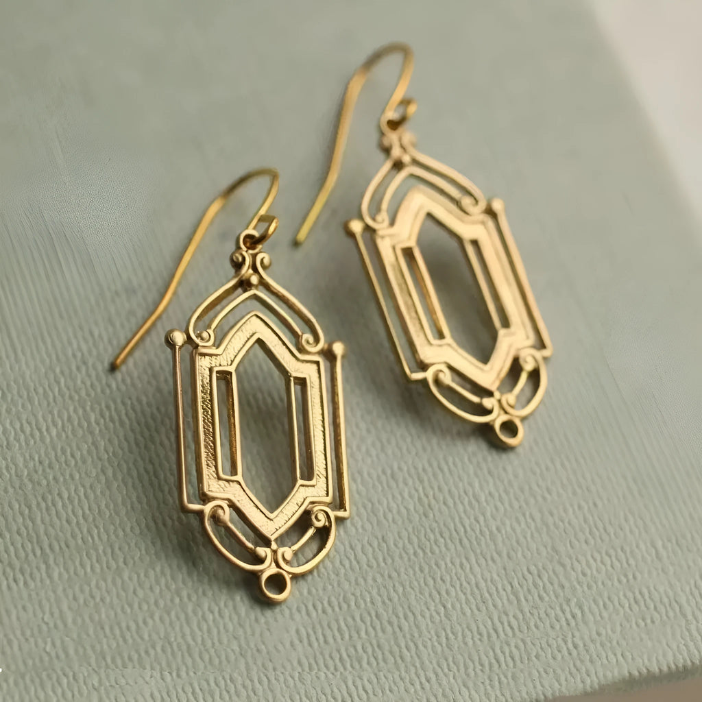 Gold flower window hollow stud earrings with geometric copper design and electroplated brass-style finish