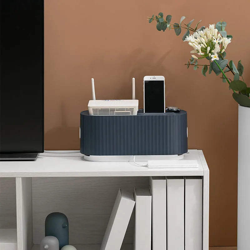 Blue and white HIPS power strip storage box with dustproof cover showing cable routing holes
