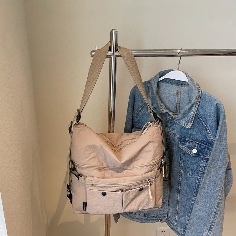 Women's nylon crossbody bag in square vertical shape with double shoulder straps and three-dimensional pockets