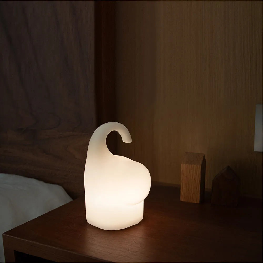 White DOMI elephant-shaped cordless silicone night light on a surface.