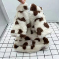 Small dog wearing pink plush winter coat for teddy, bichon or pomeranian breeds