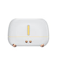 Dark grey flame humidifier with realistic orange LED light and mist output on a wooden table