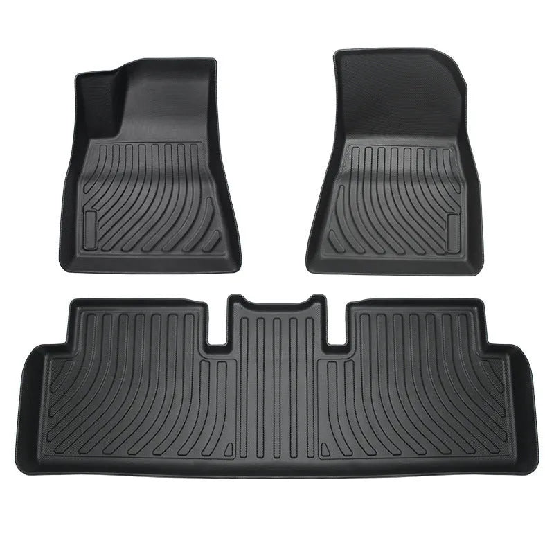 Rubber floor mat for Tesla car with TPE footrest section.