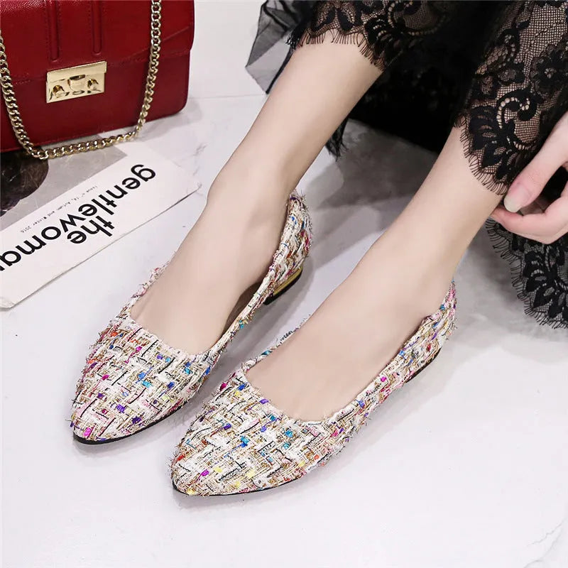 Women's black and white canvas casual shoes with pointed toe and flat rubber sole