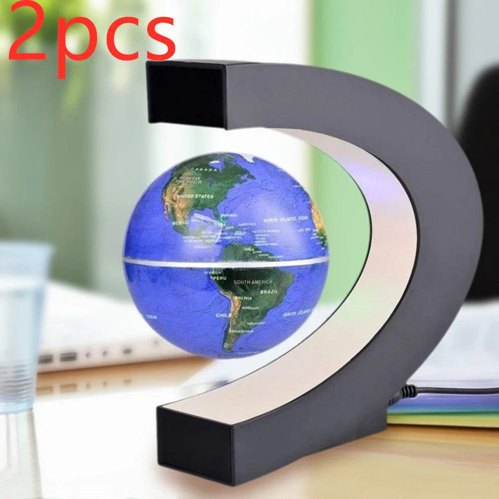 Magnetic levitation globe floating above base with LED light on