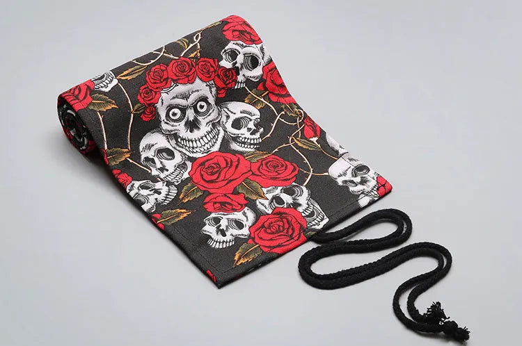 Canvas pencil wrap roll up case with multiple elastic bands holding pens and pencils, in a compact roll.