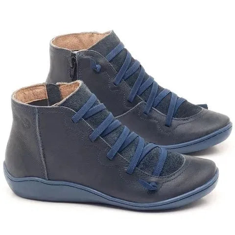 Women's casual flat ankle boots with a wedge heel and round toe in a selection of colours.