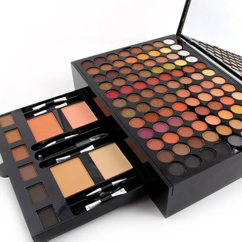 Piano-shaped box open to show 180 colour eyeshadow palette with blushes and contour powders