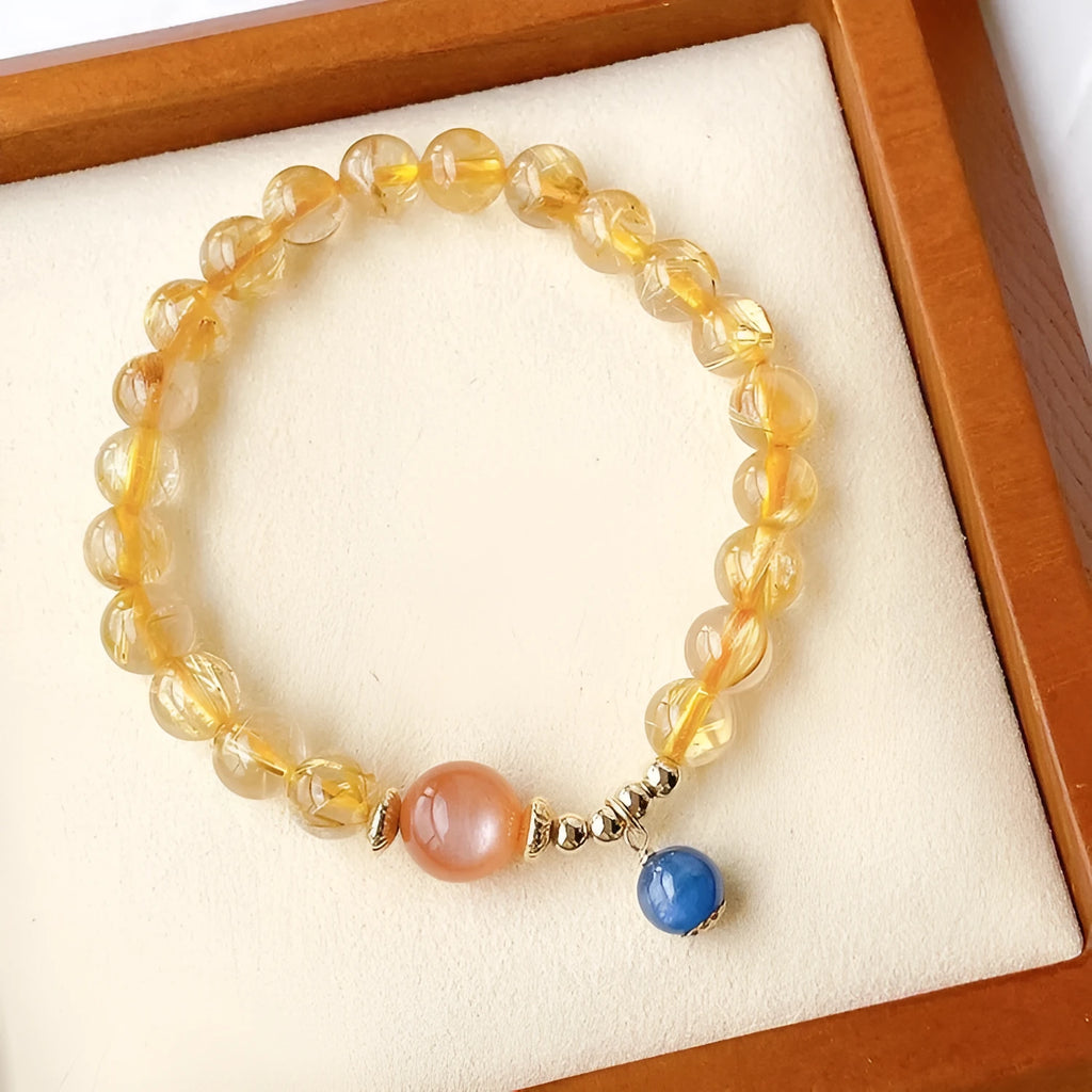 Gold rutilated quartz and sunstone bracelet with round diamond-cut beads for women