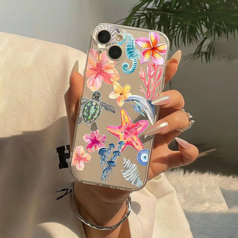 Transparent TPU iPhone case with painted dolphin and turtle design on a phone.