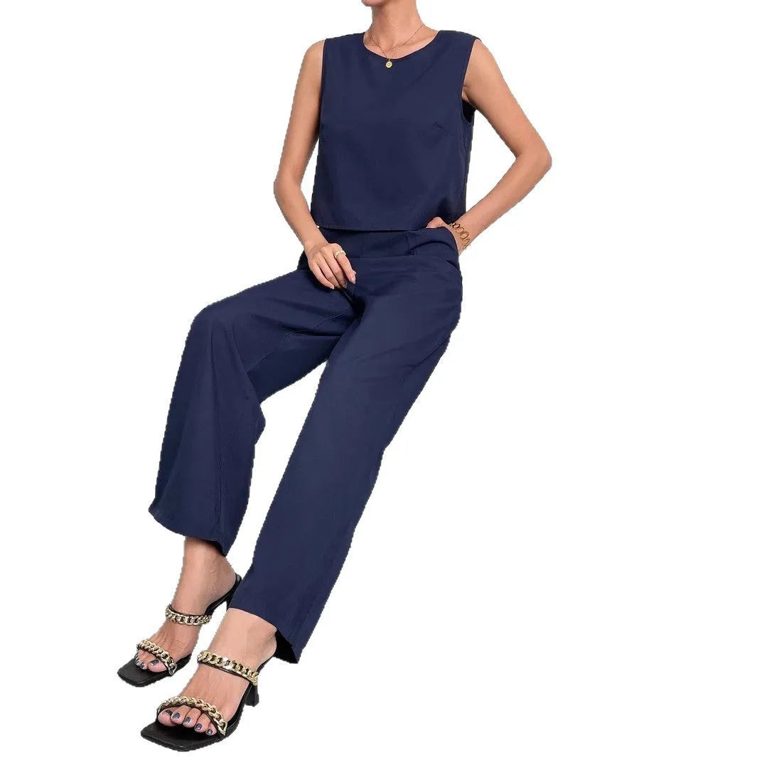 Red polyester two-piece set showing sleeveless top and wide leg trousers on Asian size mannequin