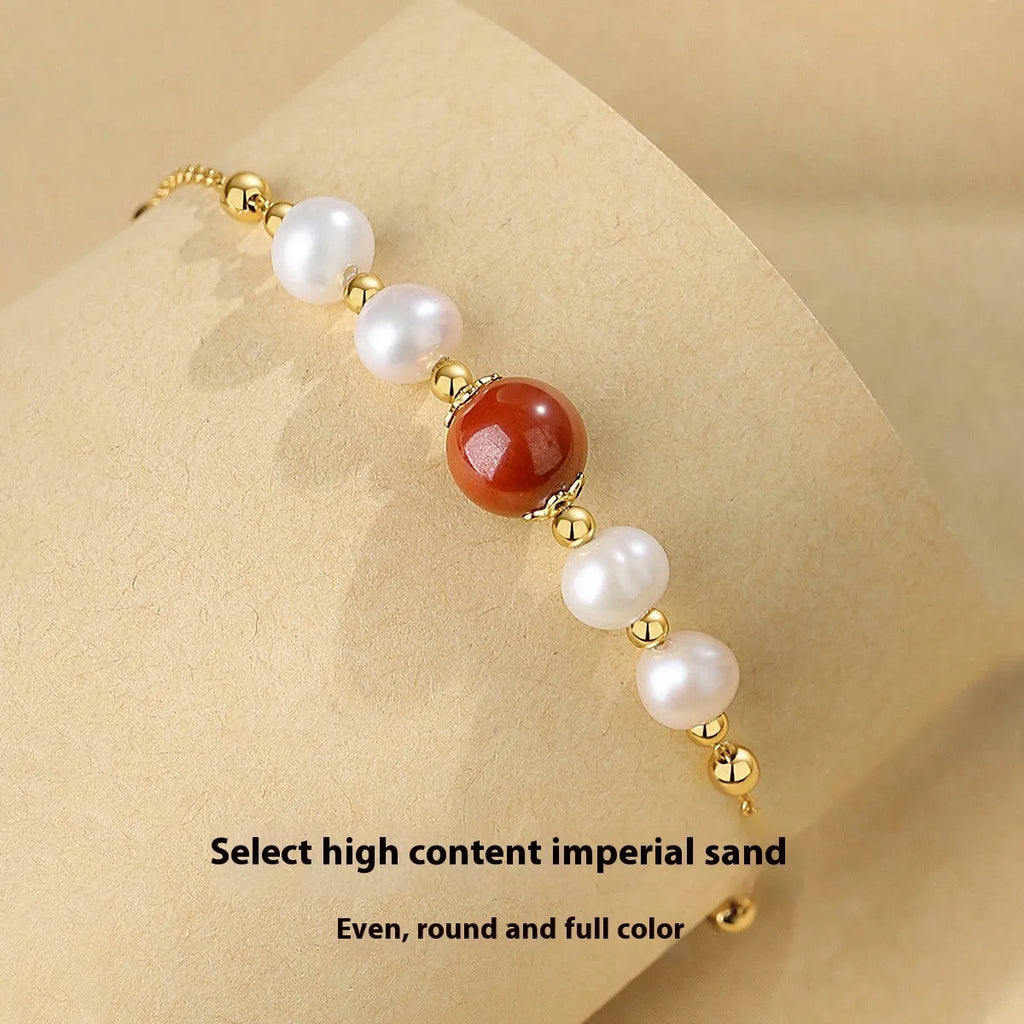 Yellow retro-style cinnabar bracelet for women made from 925 silver on a neutral background.
