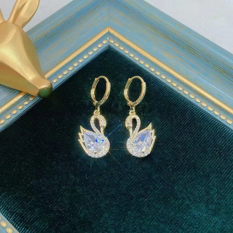 Sweet Rhinestone Swan Earrings in gold, green, and suit colours, showcasing unique design and sparkle.