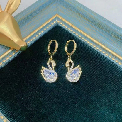 Sweet Rhinestone Swan Earrings in gold, green, and suit colours, showcasing unique design and sparkle.