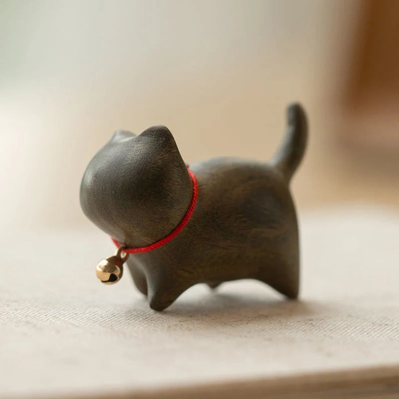 Handcrafted sandalwood kitten ornaments in various styles and colours