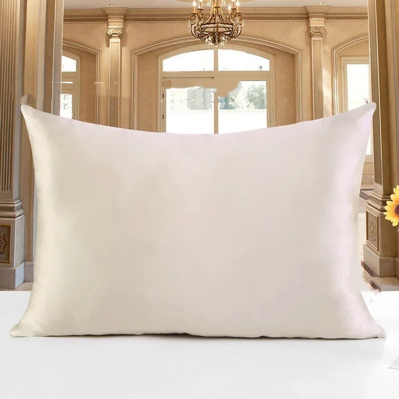 19 M double-sided silk pillowcase shown in one of 14 colours, including apricot, champagne, and navy blue.
