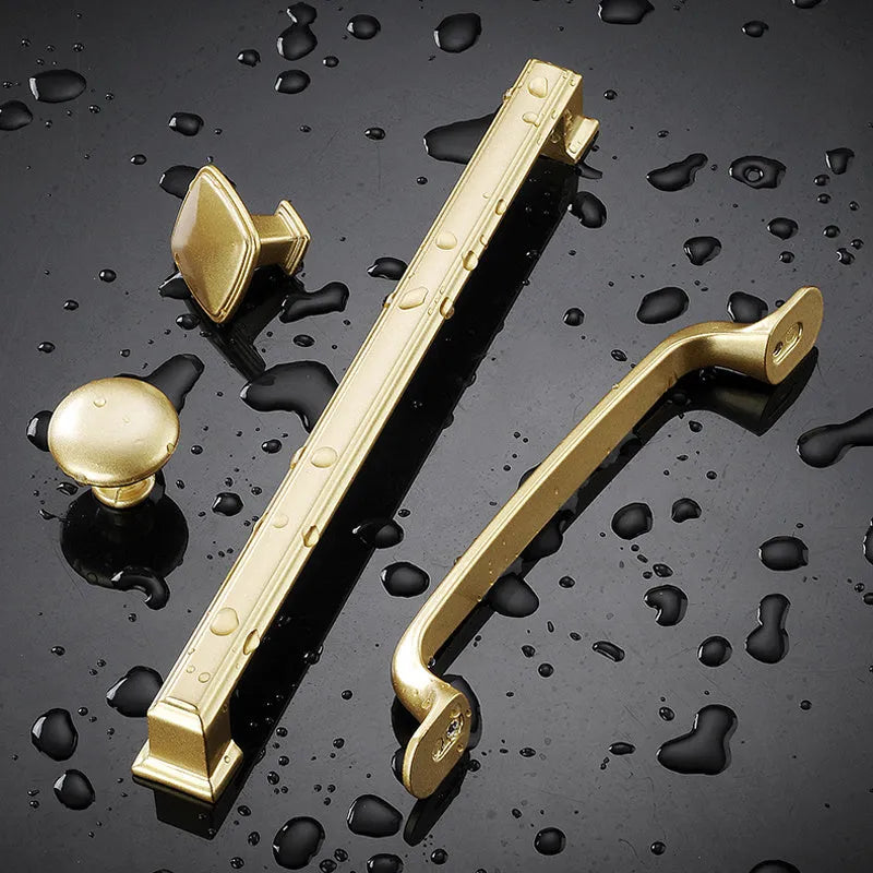 Gold T-shaped aluminium alloy single-hole cabinet handle showing three size options.